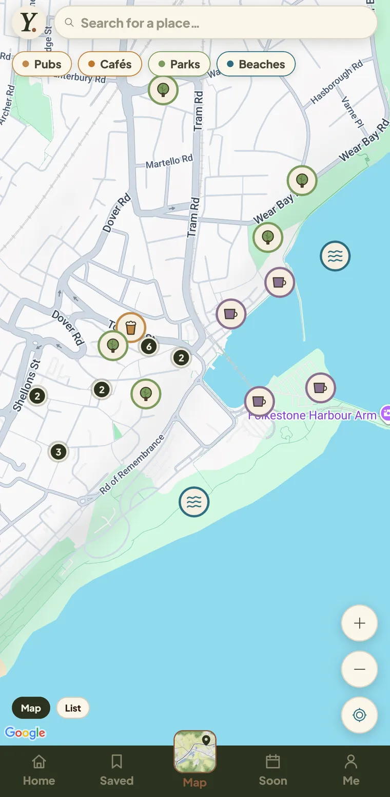 The Yomp map: dog-friendly pubs, cafés, parks and beaches shown as coloured pins across a street map of a seaside town, with category filters along the top.